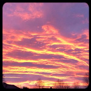 Low angle view of cloudy sky at sunset