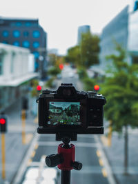 Low angle view of man holding mobile phone