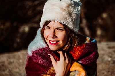 Portrait of a smiling young woman in winter