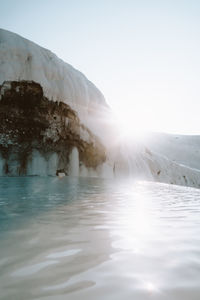 Scenic view of snowcapped mountains against clear sky