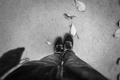 Low section of people standing on tiled floor