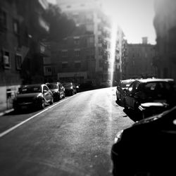 Vehicles on road along buildings