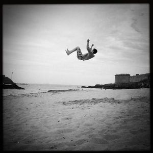 Woman jumping in sea