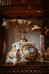 Close-up of telephone on table