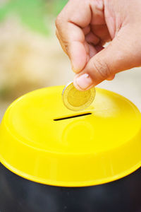 Close-up of person holding yellow juice