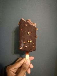 Close-up of hand holding ice cream cone