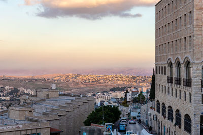 High angle view of city buildings during sunset