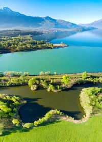 Scenic view of lake and mountains against sky