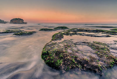 Scenic view of sea against sky during sunset