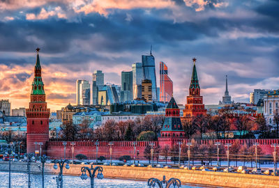 Buildings in city against cloudy sky, moscow city and kremlin 