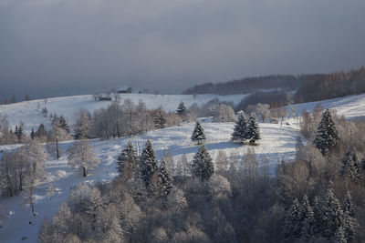 Scenic view of snow covered mountains against sky