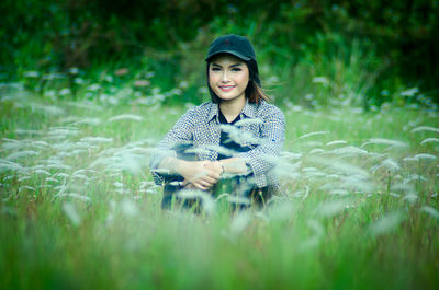 Portrait of beautiful young woman on land