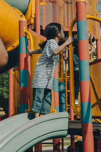 Little girl playing at the playground.