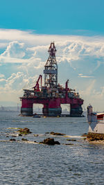 View of ship in sea against sky