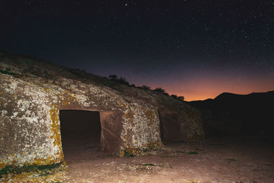 Old building against sky at night