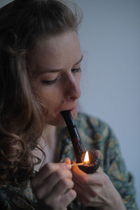 Portrait of girl holding burning candle