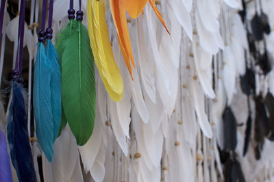 Close-up of multi colored umbrellas hanging at market stall