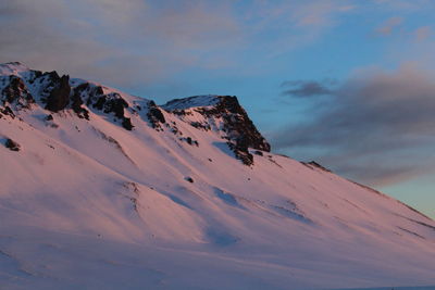 Scenic view of snow covered mountain against sky