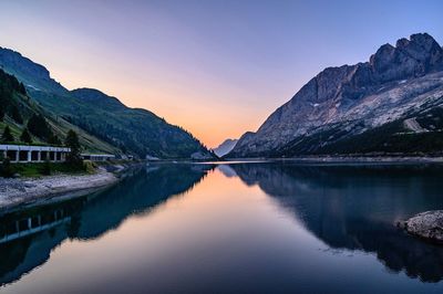 Scenic view of lake against sky during sunrise