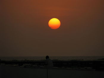 Scenic view of sea against clear sky during sunset