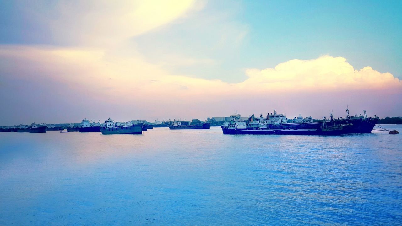 water, sea, waterfront, sky, sunset, tranquility, tranquil scene, nautical vessel, scenics, beauty in nature, transportation, cloud - sky, nature, reflection, cloud, boat, harbor, blue, rippled, idyllic