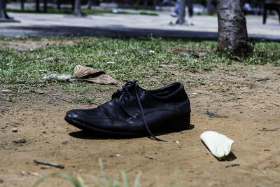Close-up of shoes on ground