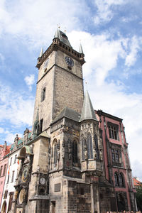 Low angle view of clock tower against sky