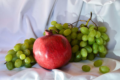 Close-up of grapes in plate on table