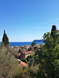 Scenic view of sea against clear blue sky