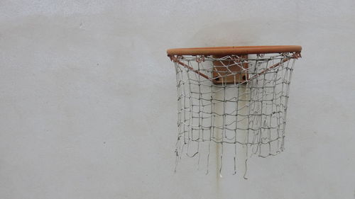 Close-up of basketball hoop on wall