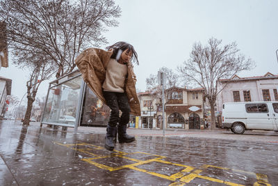 Full length of man standing on street