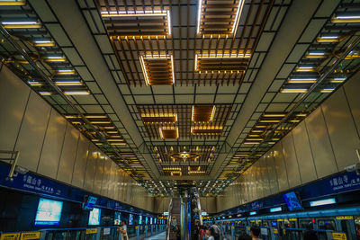 Low angle view of illuminated subway station