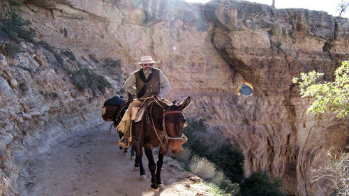 Man riding motorcycle on rock