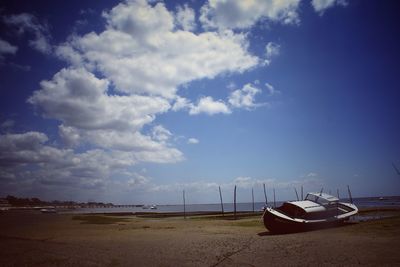 Abandoned boat on shore