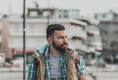 Portrait of young man standing outdoors