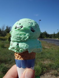 Close-up of hand holding ice cream