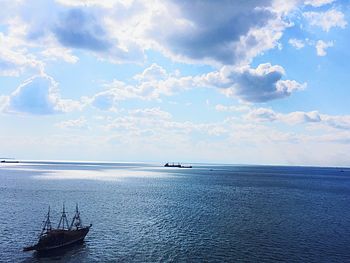 Scenic view of sea against cloudy sky