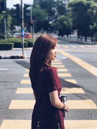 Woman standing on road