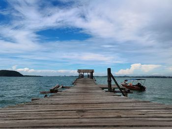 Pier over sea against sky