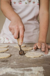 Close-up of woman baking cookies