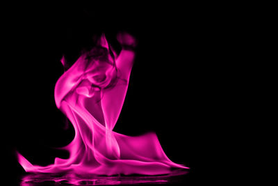 Close-up of fire against black background