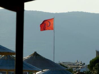 Red flag against clear sky