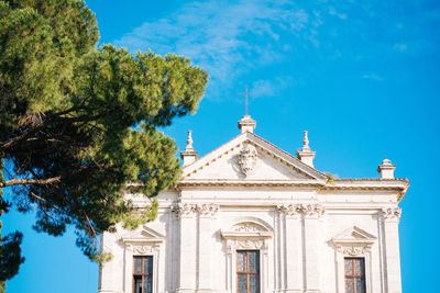 Low angle view of built structure against blue sky