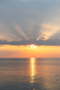 Scenic view of sea against romantic sky at sunset