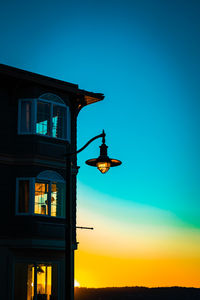 Hotel and light fixture during sunset 