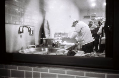 People working in glass window