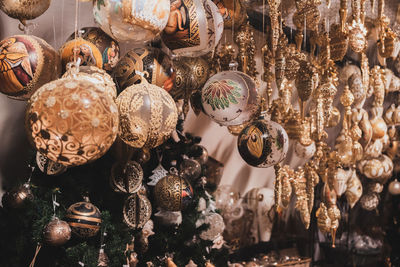 Close-up of christmas decorations hanging at market stall