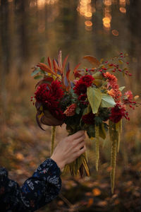 Close-up of hand holding bouquet