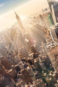 High angle view of modern buildings in city against sky