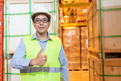 Portrait of smiling man standing in office